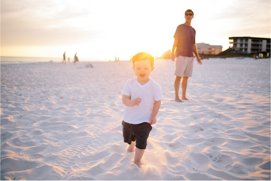 baby playing on beach
