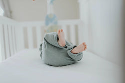 baby lying in crib
