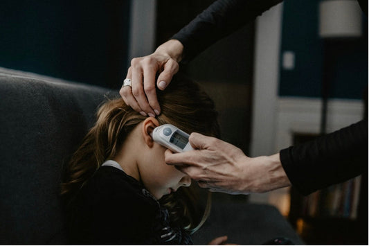 child with thermometer